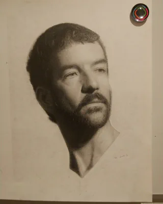 Charcoal portrait of a bearded man