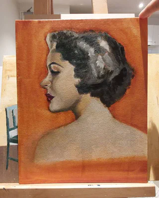 Painted profile portrait on an easel